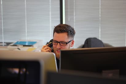 121eCommerce Account Manager on Phone